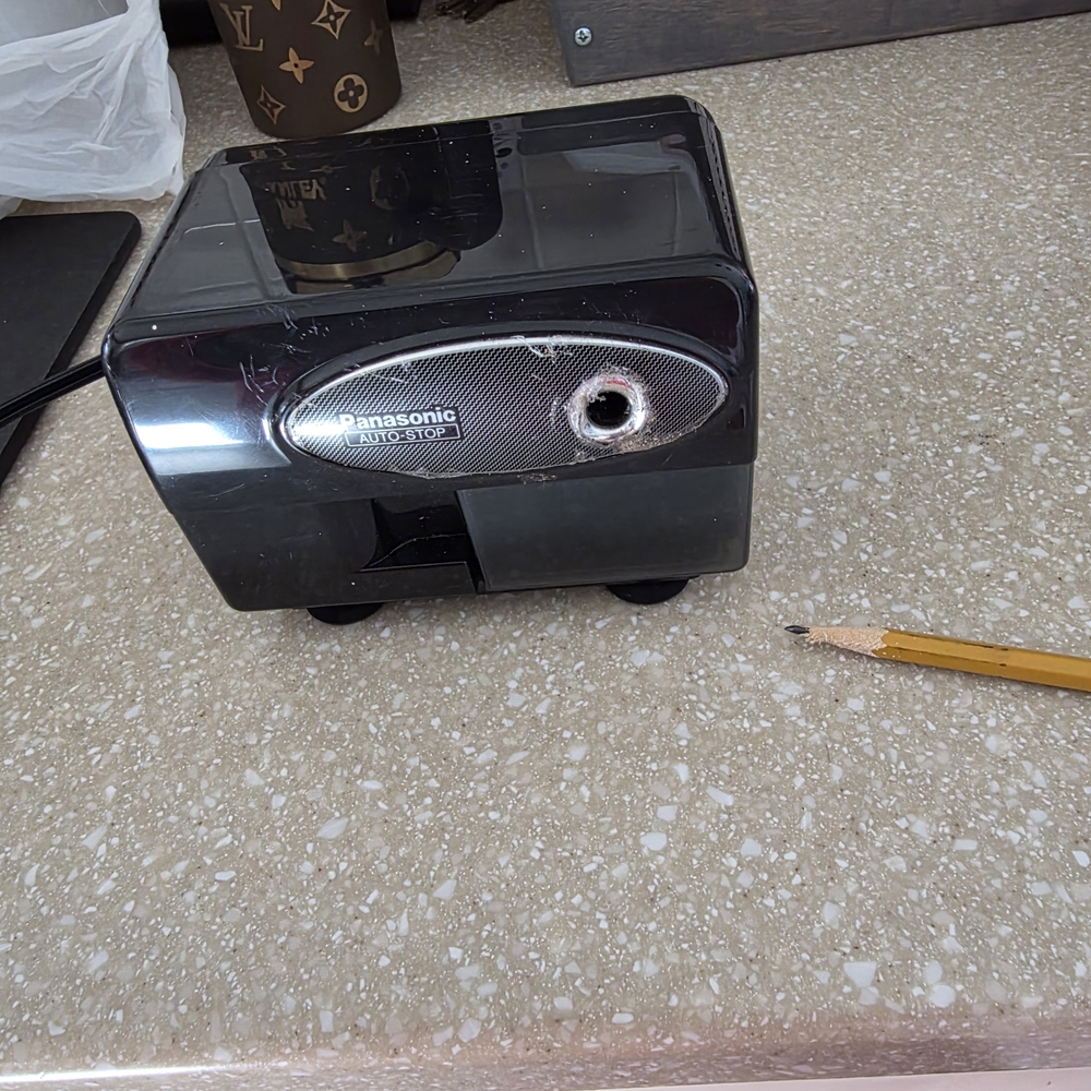 Rough Around The Edges Panasonic Black and Silver Electric Pencil Sharpener